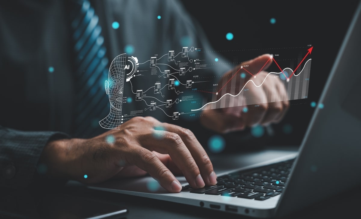 Business professional interacting with data and cybersecurity icons on a laptop.